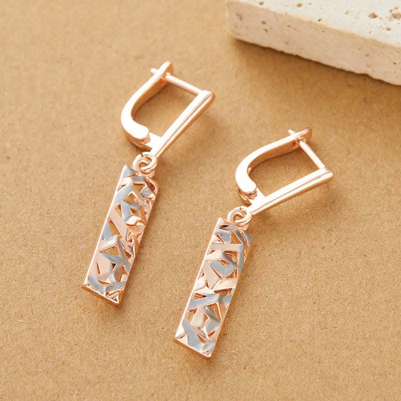 Rectangular two-tone hollow stud earrings with geometric shape and electroplated finish
