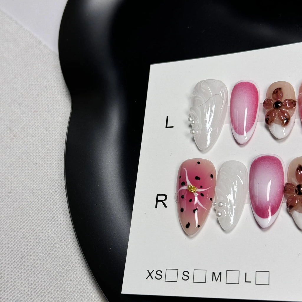 Hand-painted 3D candy pattern false nail art patches in almond shape on a plastic set.