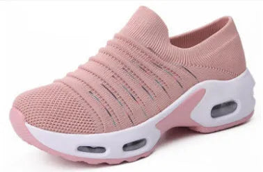 Women's stretch knitted sock shoes in various colours showing mesh upper and round toe design.