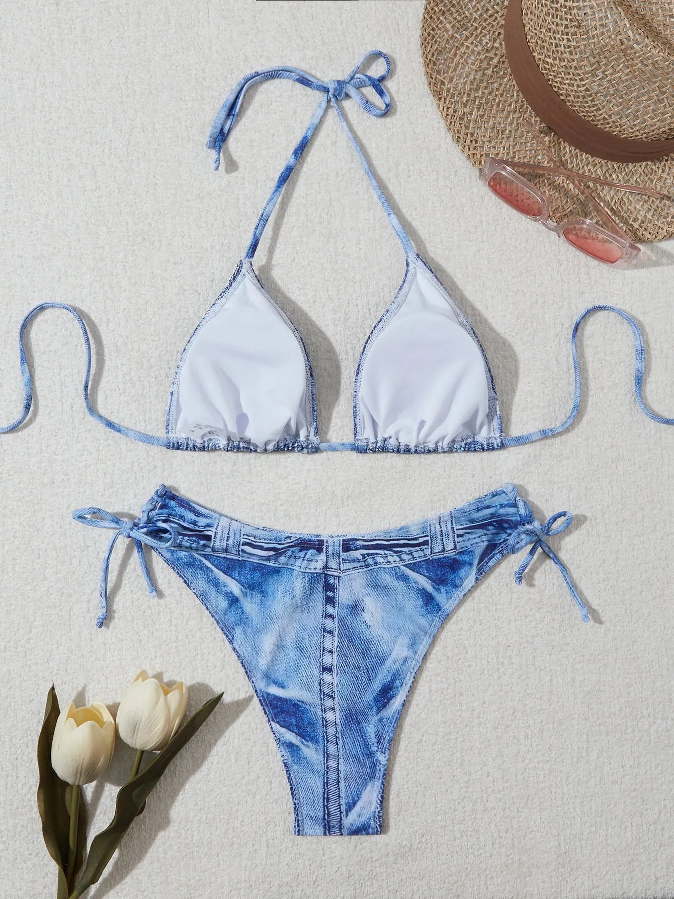 Denim blue printed women's bikini set with strap design on a model, showing front and back.
