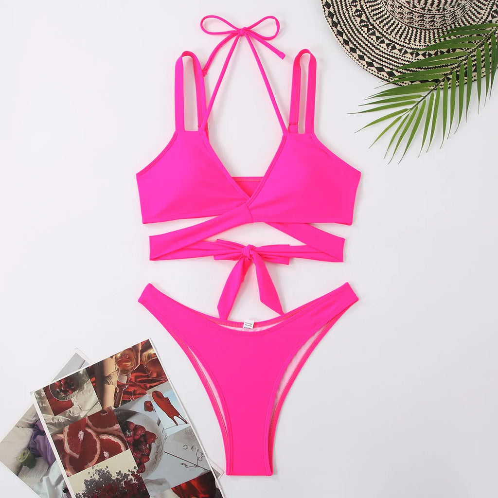 Women's solid colour bikini swimsuit with adjustable straps on triangle top in black, blue, red, rose red, or white