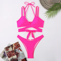 Women's solid colour bikini swimsuit with adjustable straps on triangle top in black, blue, red, rose red, or white