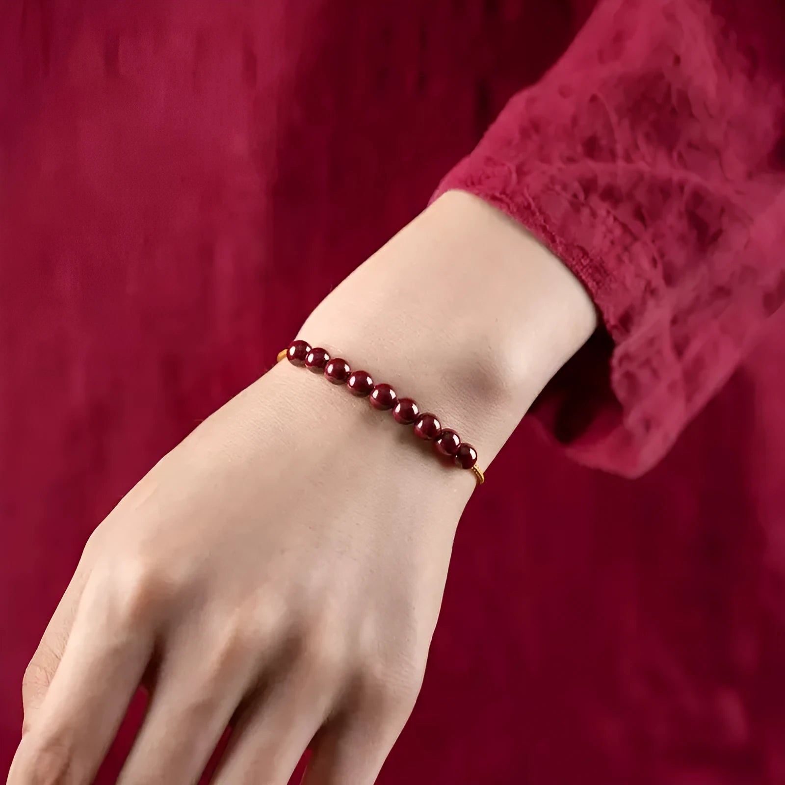Hand-woven bracelet made from raw cinnabar ore and Hetian jade in a simple geometric shape.