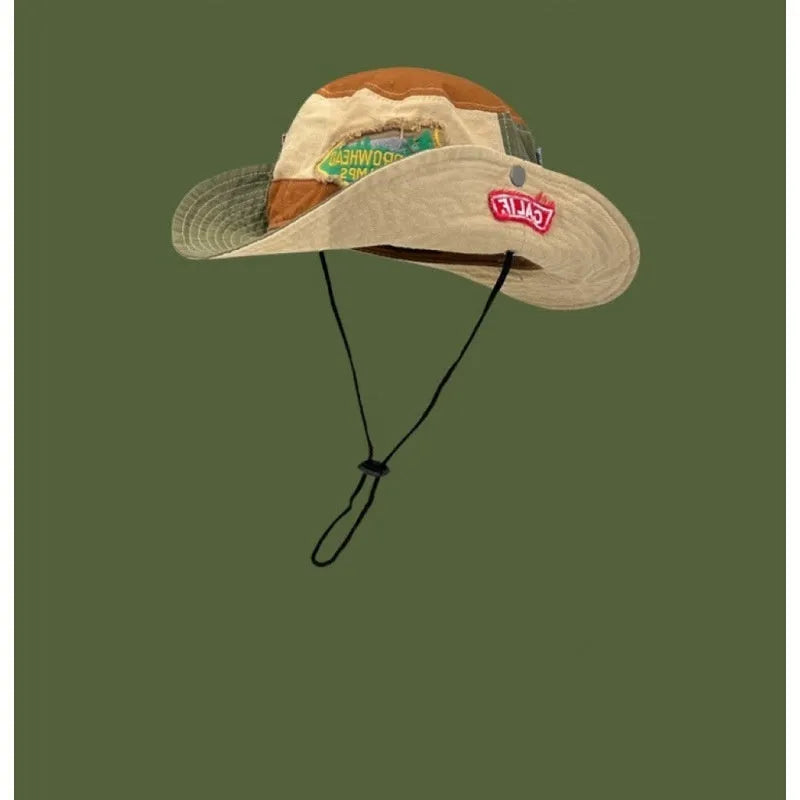 Army green cotton fisherman hat with patchwork details and flat-top crown, folded for display