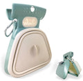 Blue portable dog pooper scooper with clip and expandable waste container next to a dog leash.