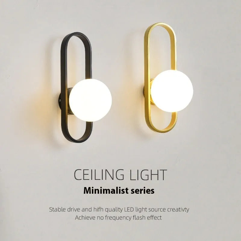Minimalist wall lamp with glass shade and iron body in black or gold finish showing 12W bulb options