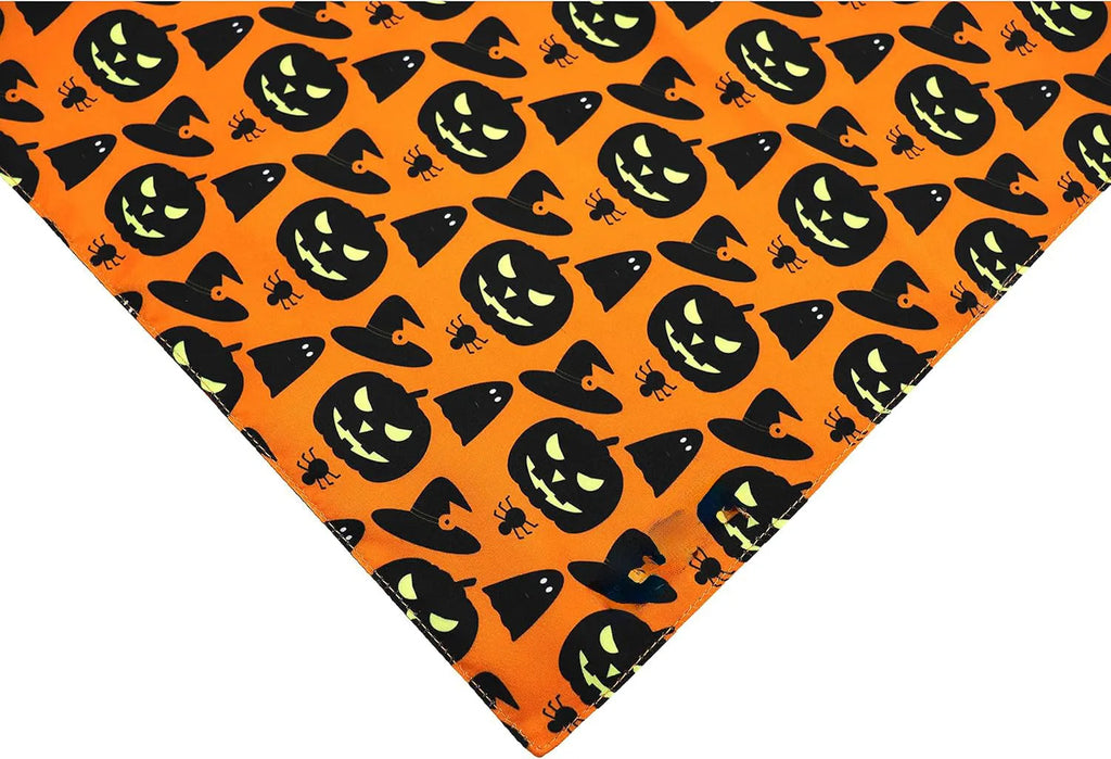 Reversible Halloween dog bandana showing pumpkin and spider web patterns with adjustable neck fastening