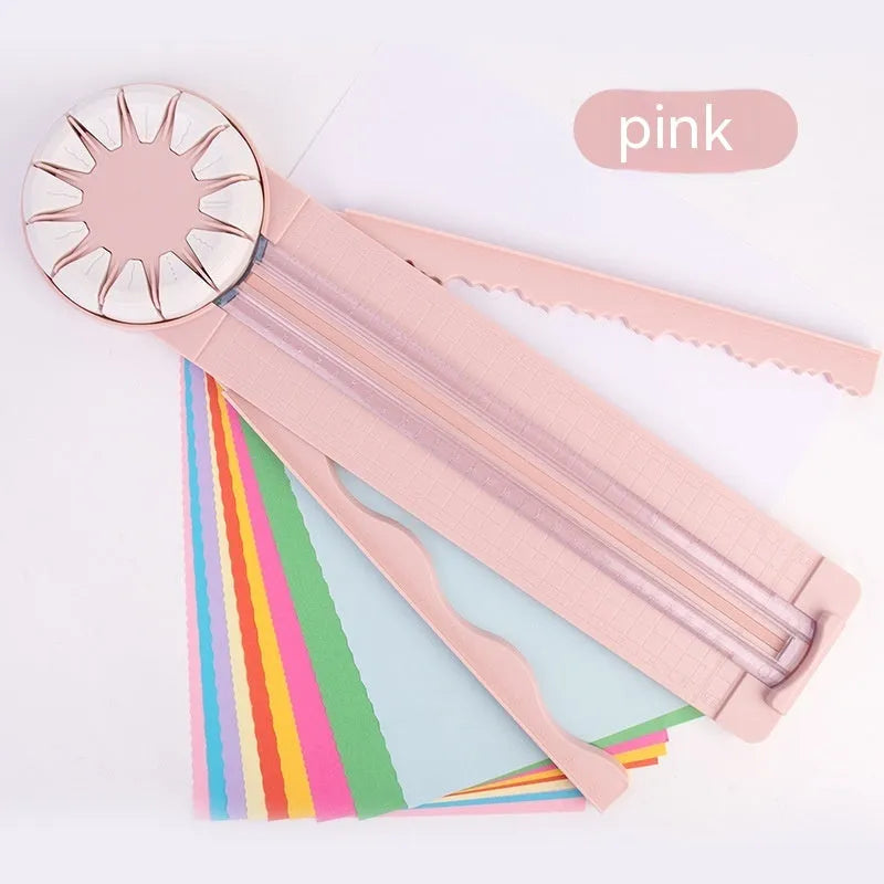 Plastic paper cutting machine with 12 patterns in pink colour on craft table