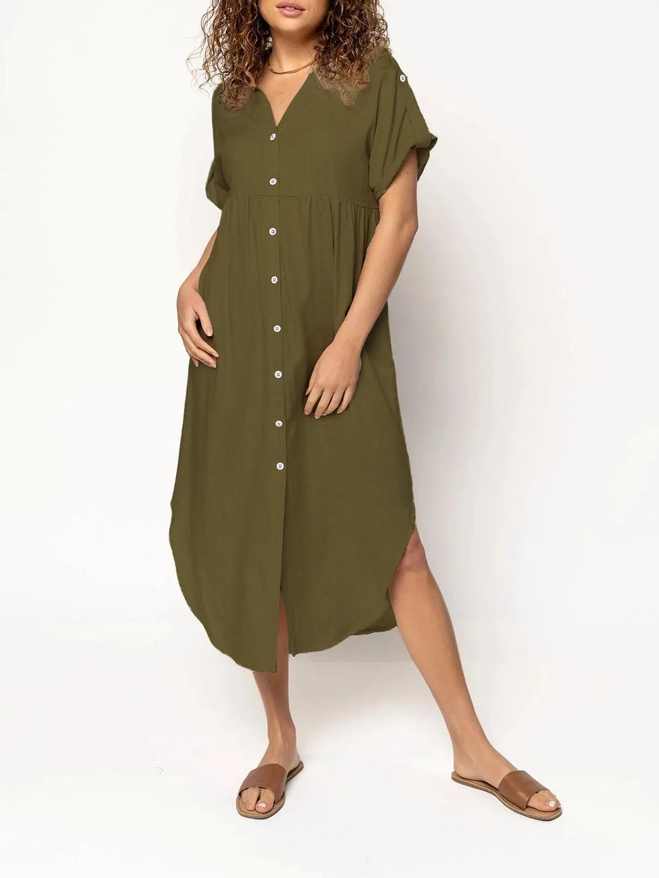 A loose-fitting, mid-length casual dress with button detail on the front, shown in a solid colour.