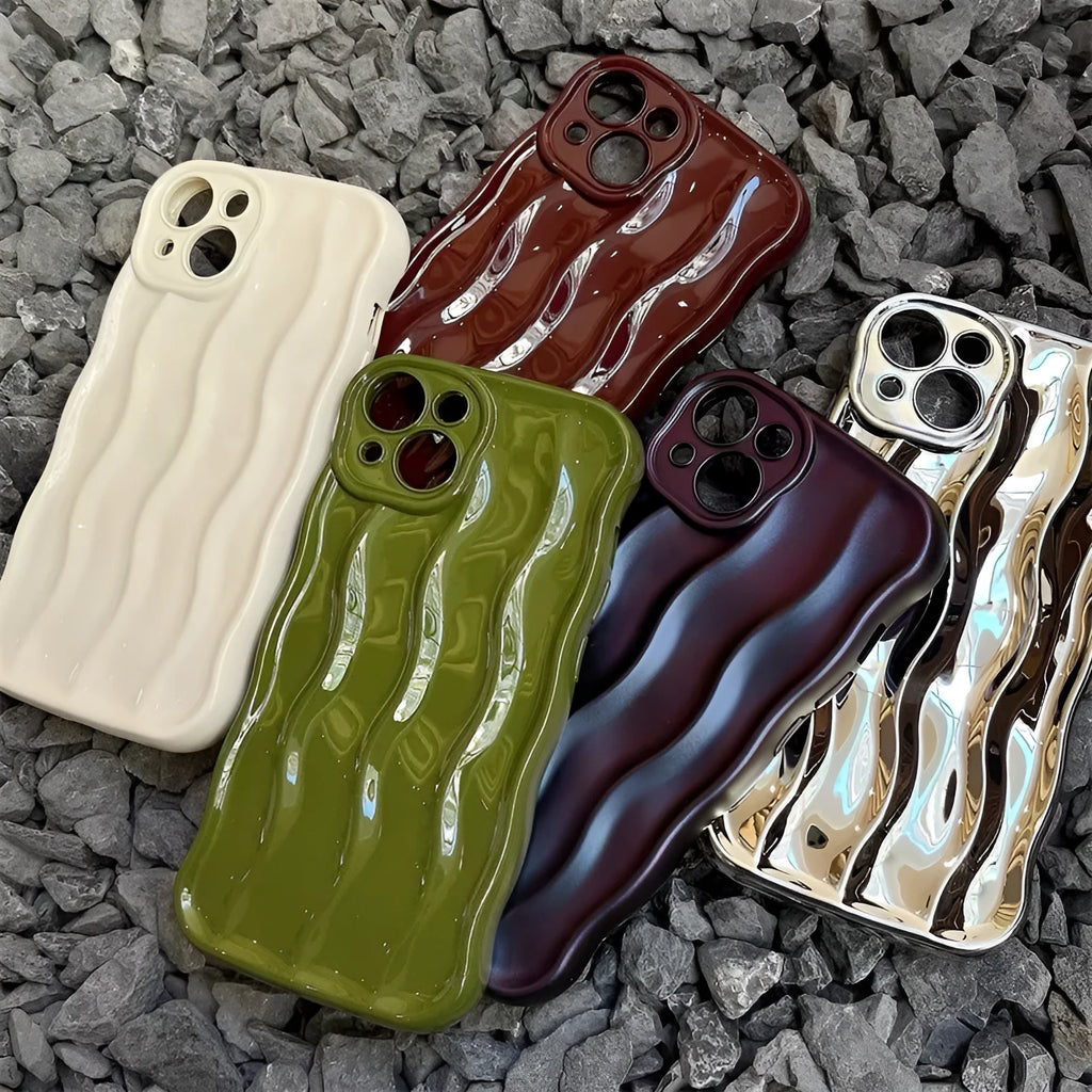 Silicone mobile phone case for iPhone 17 with a solid green colour and water ripple texture on a flat surface.
