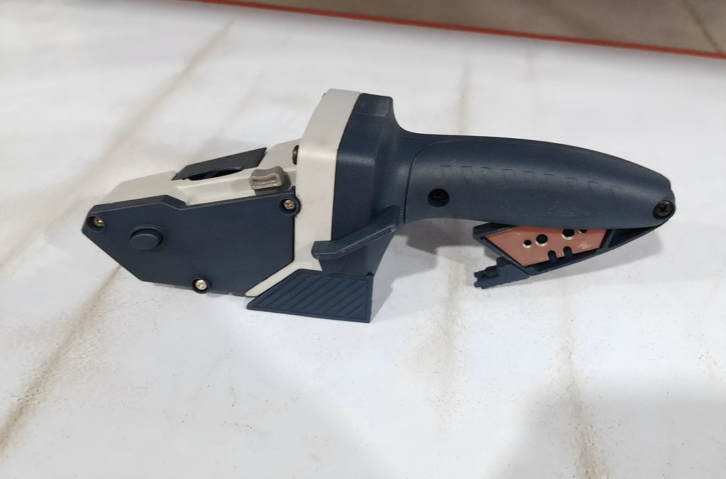 Blue aluminium alloy woodworking cutter with TPR plastic handle and a measuring scale.