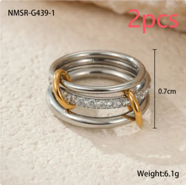 Gold plated exaggerated stackable ring for women on a hand, showing layered jewellery style.