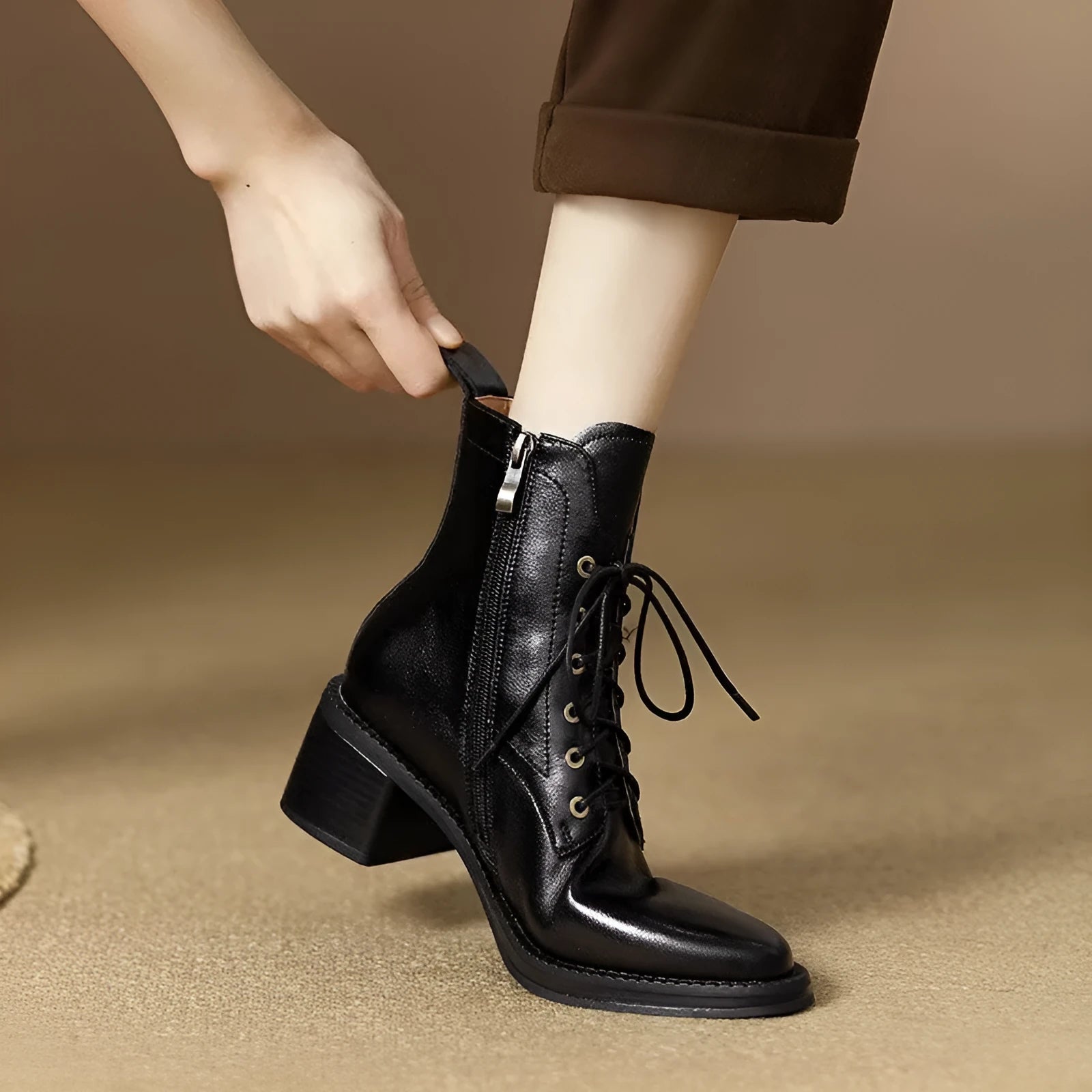 Women's black pointed toe short tube ankle boots with 5.5cm heel on wooden floor