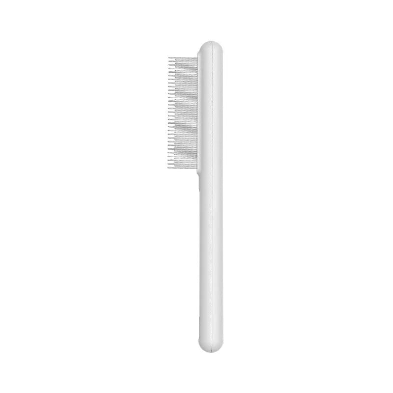 Cat comb with rounded stainless steel teeth and ergonomic handle on white background