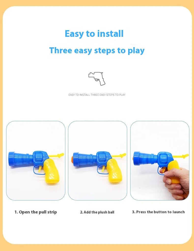 Pet toy launcher gun and soft plush balls for interactive play with cats and dogs.