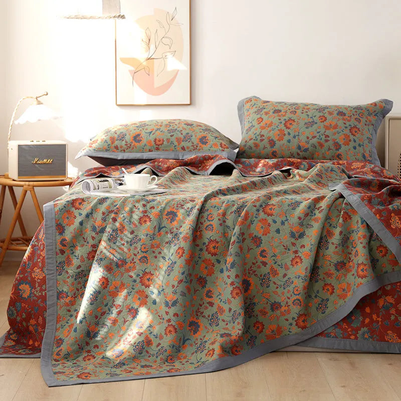 Cotton gauze bed blanket set with plant and flower pattern showing blanket and two pillowcases