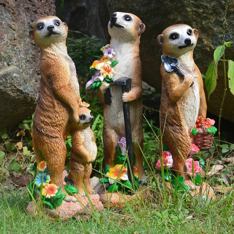 Resin mongoose garden ornament with straw hat and garden tool accessory