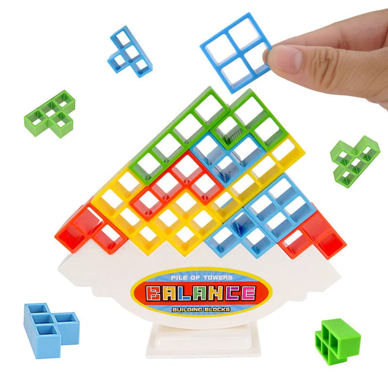 Balance stacking board game with 16 plastic coloured building blocks, base and chassis on a flat surface