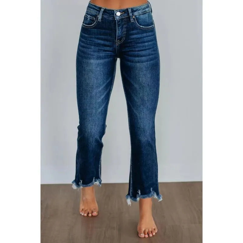 Women's dark blue cotton denim trousers with hand-worn finish, casual style