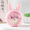Pink and blue cartoon-style children's alarm clock showing night light and display