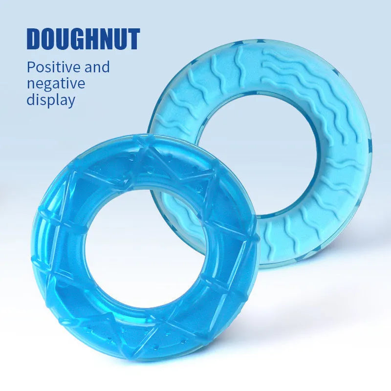 Set of three plastic dog chew toys: a blue pacifier, a red popsicle, and a green ring, designed to be filled with water and frozen.