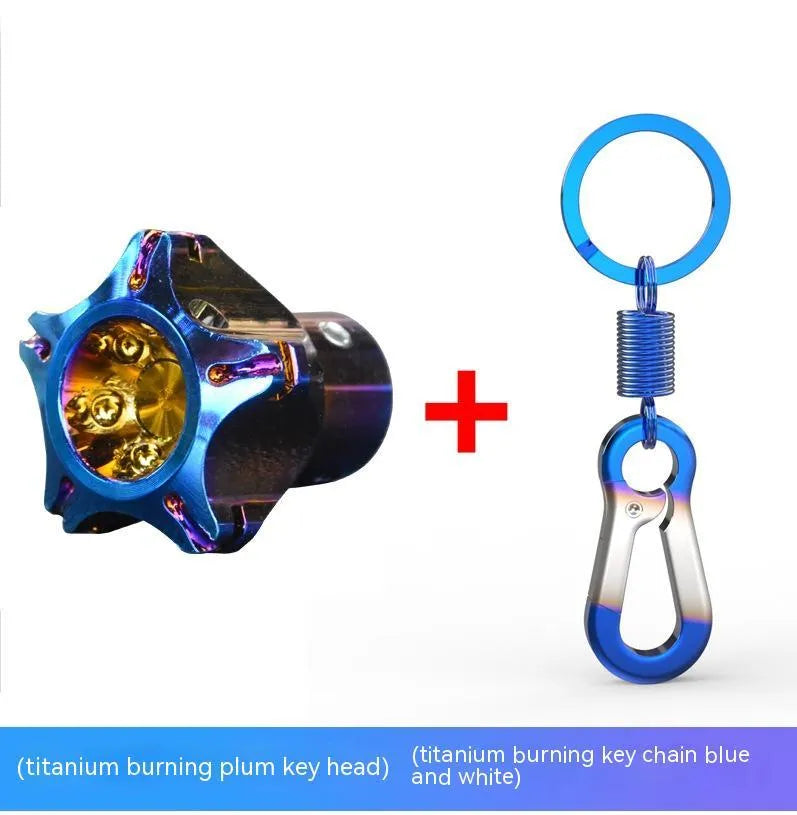 T6 aluminium motorcycle key cover in hexagonal, pentagram, and plum blossom designs with blue and white keychain.