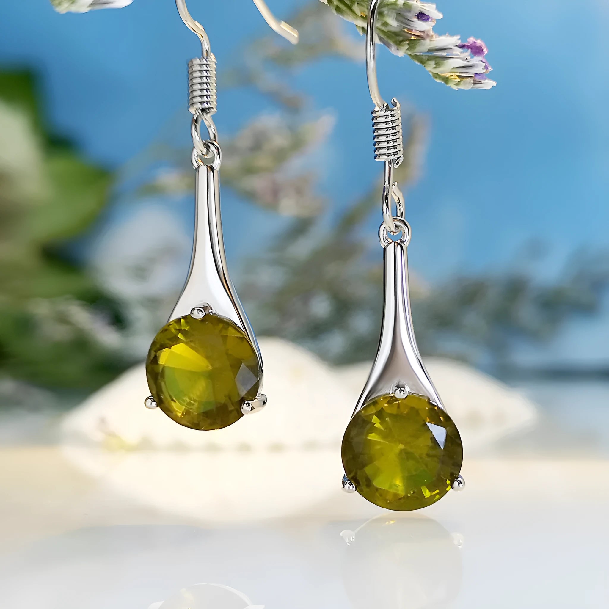 Olive green topaz drop earrings with water drop shape and retro styling