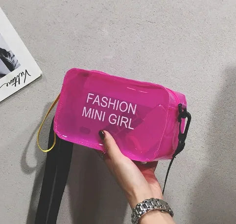 Transparent square women's shoulder bag in jelly material with a diagonal cross strap, showing internal mobile phone pocket.