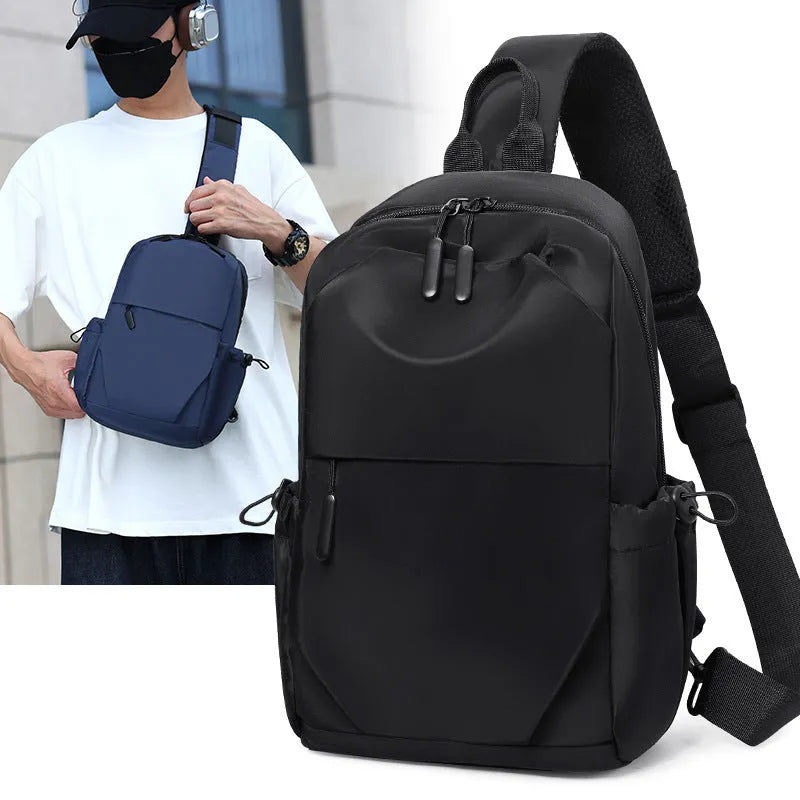 Men's grey waterproof chest bag showing front view with shoulder strap and large main compartment.