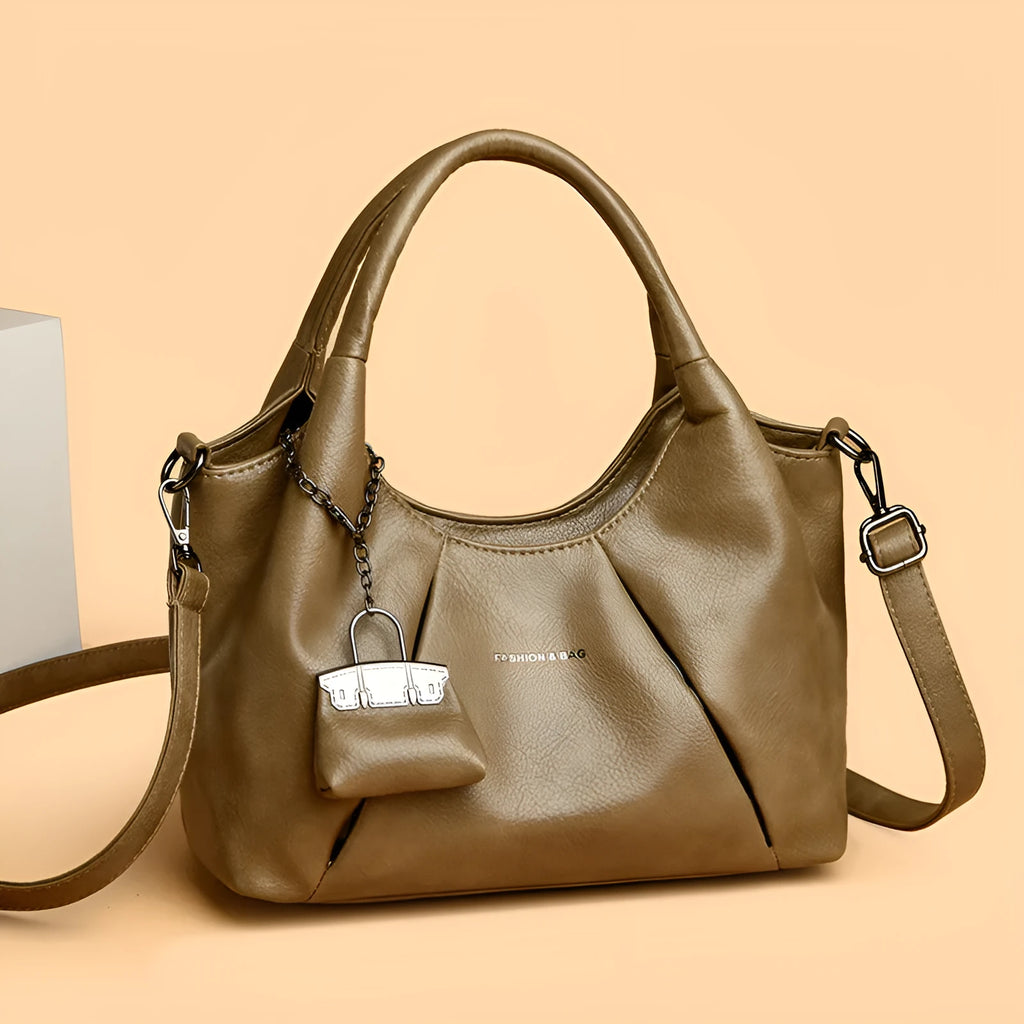 Trendy niche women's new shoulder bag in genuine leather with dumpling shape and pleated detail, khaki colour