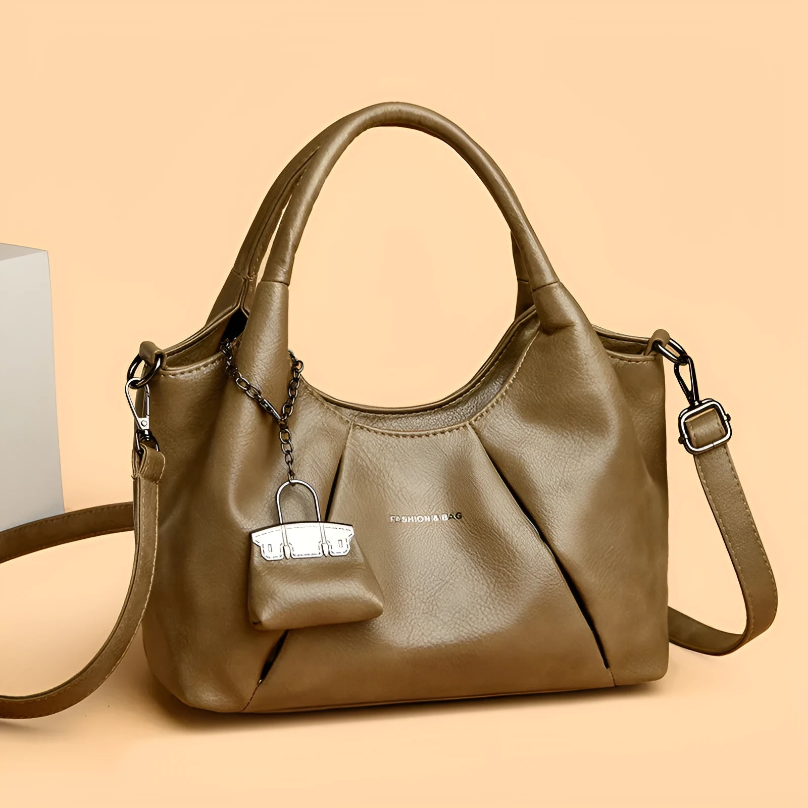 Trendy niche women's new shoulder bag in genuine leather with dumpling shape and pleated detail, khaki colour