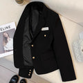 Women's loose fit short suit coat in black polyester fabric with pockets.