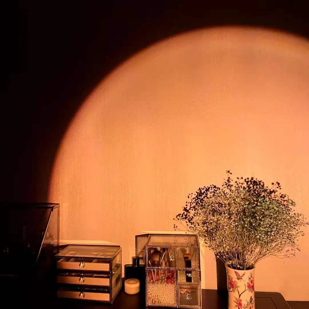 Sunset red coloured USB rechargeable projection lamp showing rainbow light projection