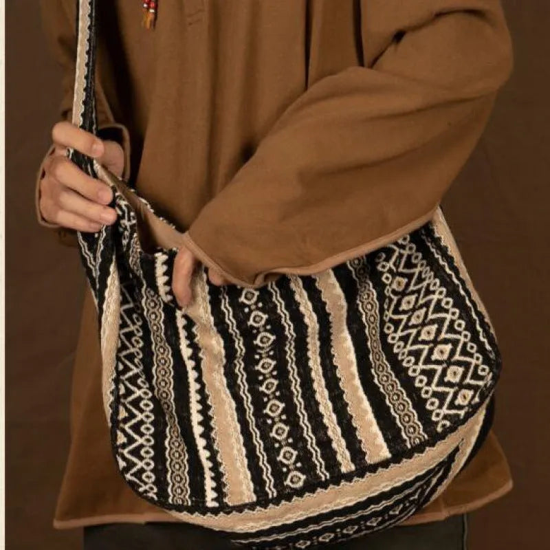 Retro striped corduroy messenger bag with vintage handprint detailing and adjustable plaid shoulder strap