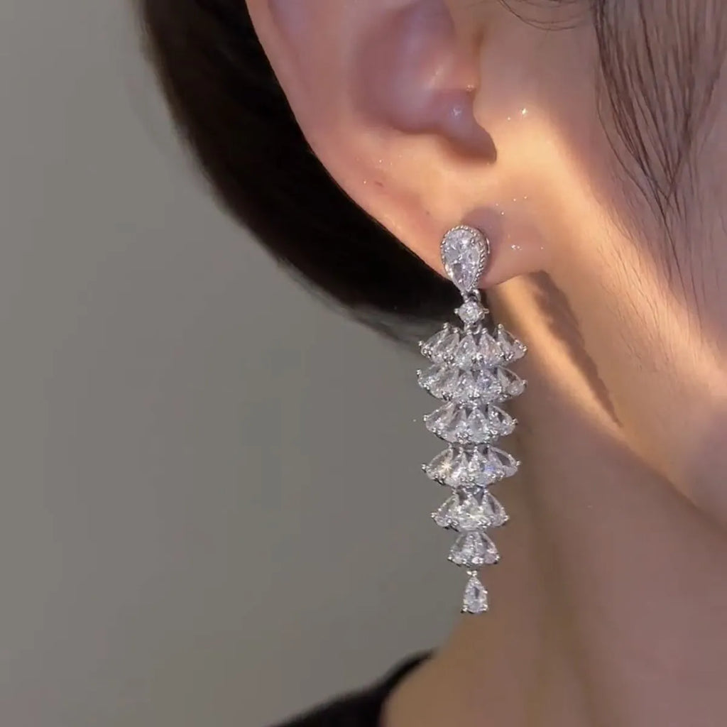 Christmas tree shaped drop earrings with sparkling zircon stones in silver pagoda colour