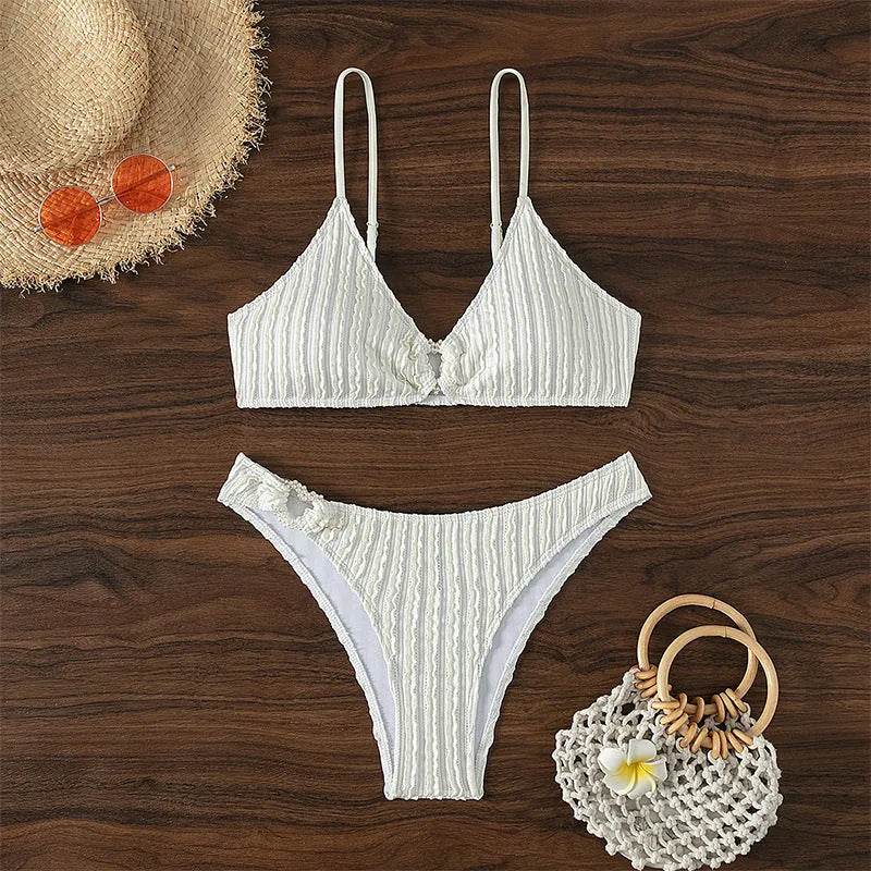 White women's V-neck beach swimsuit two-piece set with sleeveless top and split shorts