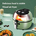 Air fryer oven with visible window showing food inside, mechanical buttons, and 8-litre capacity basket