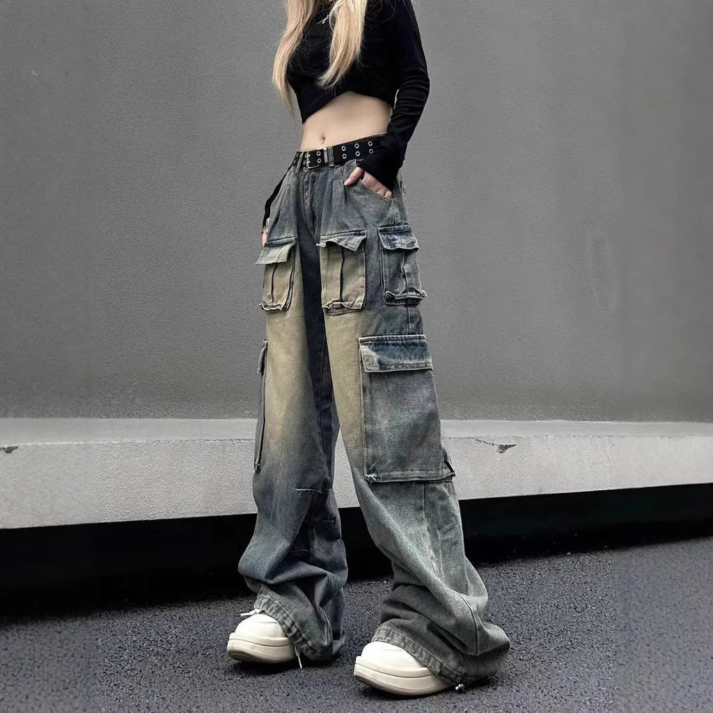 Loose fit distressed denim trousers with multiple pockets in light blue colour