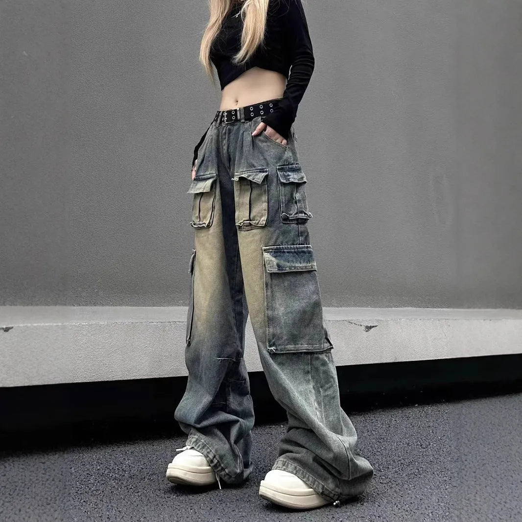 Loose fit distressed denim trousers with multiple pockets in light blue colour