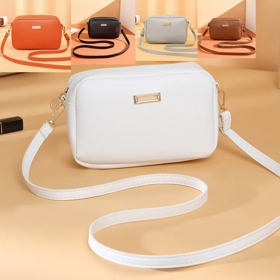 Women's solid colour PU leather shoulder bag with three-dimensional pocket and square shape.