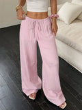 Women's black wide-leg trousers with lace-up waist detailing and adjustable ties