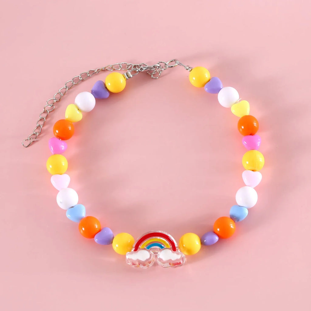 Colourful plastic bead cat necklace in small flower, rainbow, or peach design on a cat.