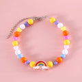 Colourful plastic bead cat necklace in small flower, rainbow, or peach design on a cat.
