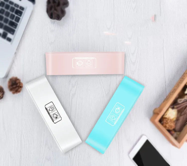 Blue rectangular LED atmosphere light alarm clock with digital display on wooden surface