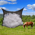 Black woven PE rope hanging feeding bag for horses, shown with hay, next to a white version.
