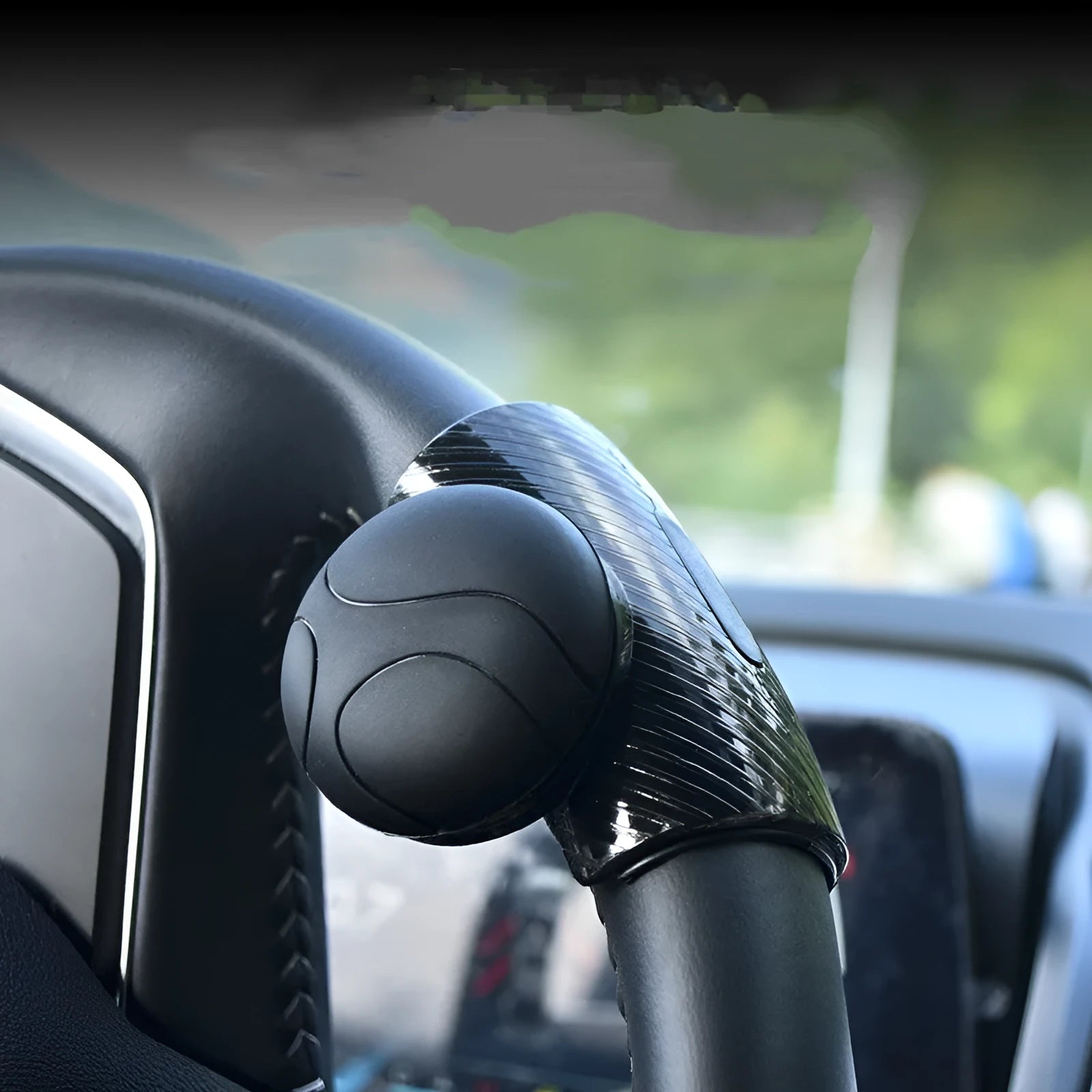 Black silicone steering wheel assist ball with metal bearing for single hand driving
