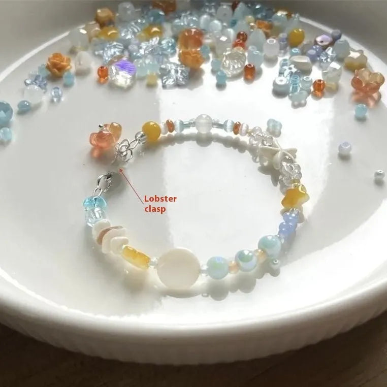 Orange sea colour diamond bracelet with round accents on adjustable alloy band