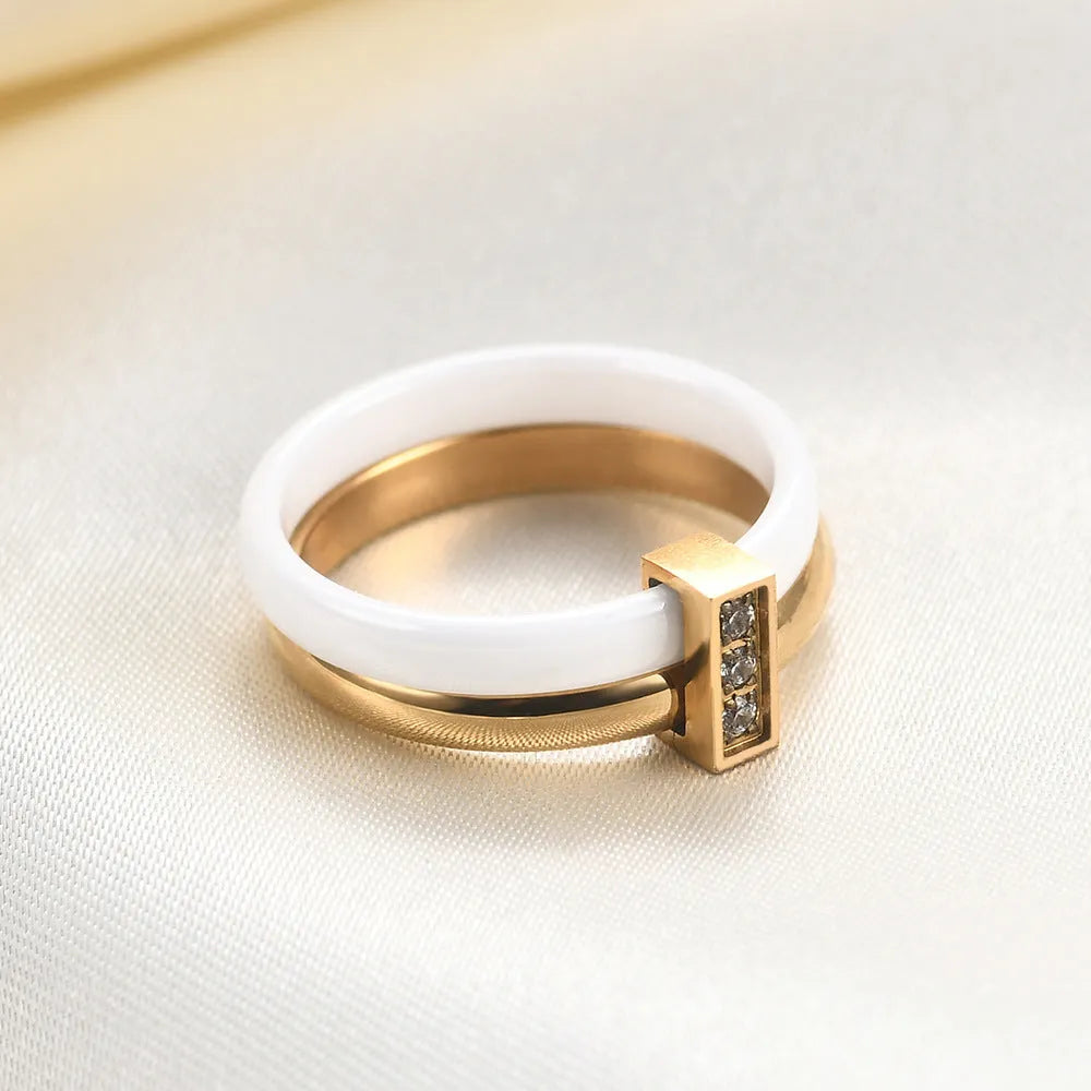 Ceramic women's ring with 6mm zirconium inlay in geometric design, available in steel black or gold white finishes
