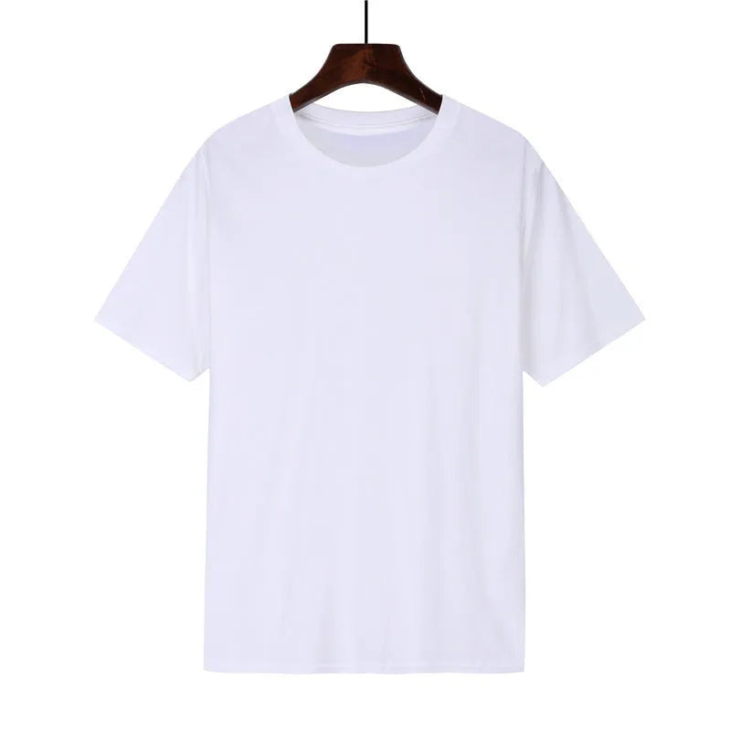 Man wearing a black loose-fit cotton T-shirt with short sleeves, showcasing casual style.