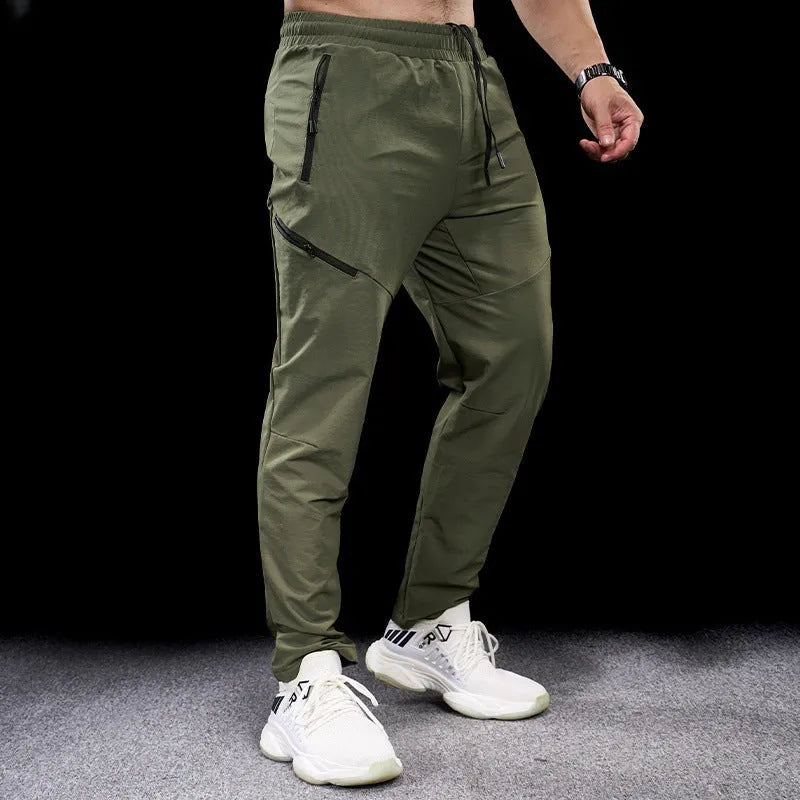Men's nylon workout pants in mid-waist cut with quick-drying properties for sports and fitness